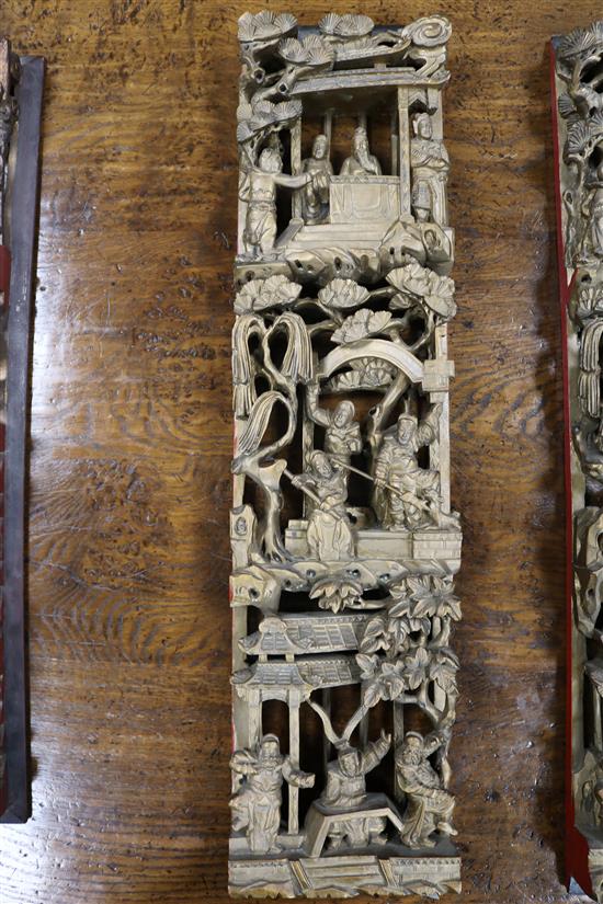 Six Chinese carved giltwood upright panels, soldiers and birds amid foliage